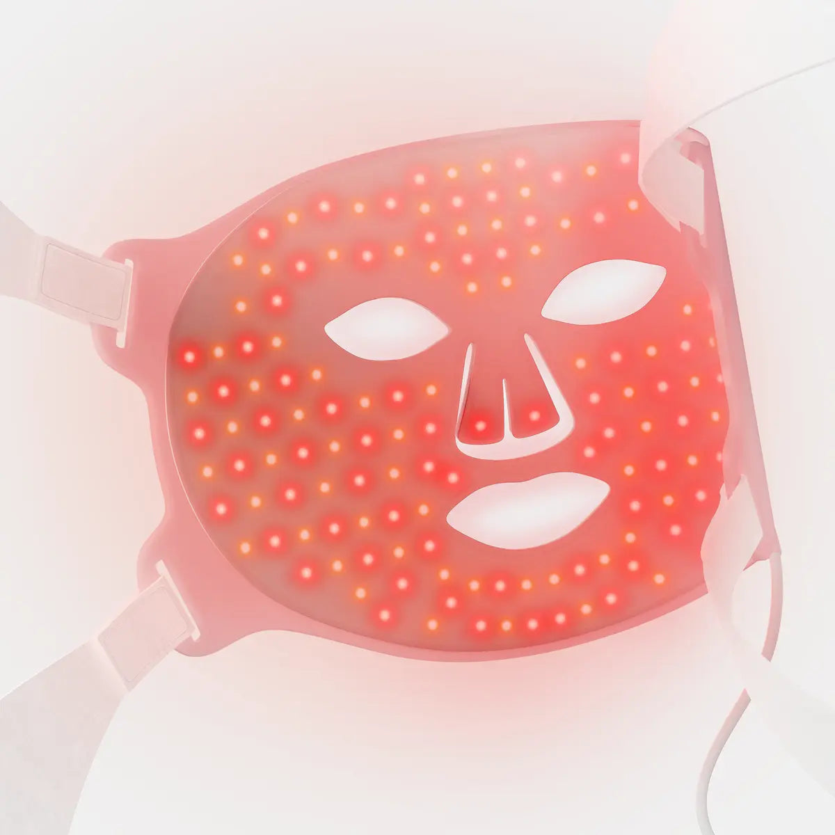 Pink LED face mask with red and amber lights, white eye and mouth cutouts, and adjustable straps.